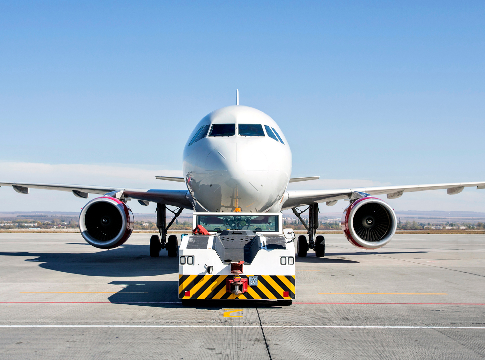 The Plane With The Airfield Tractor